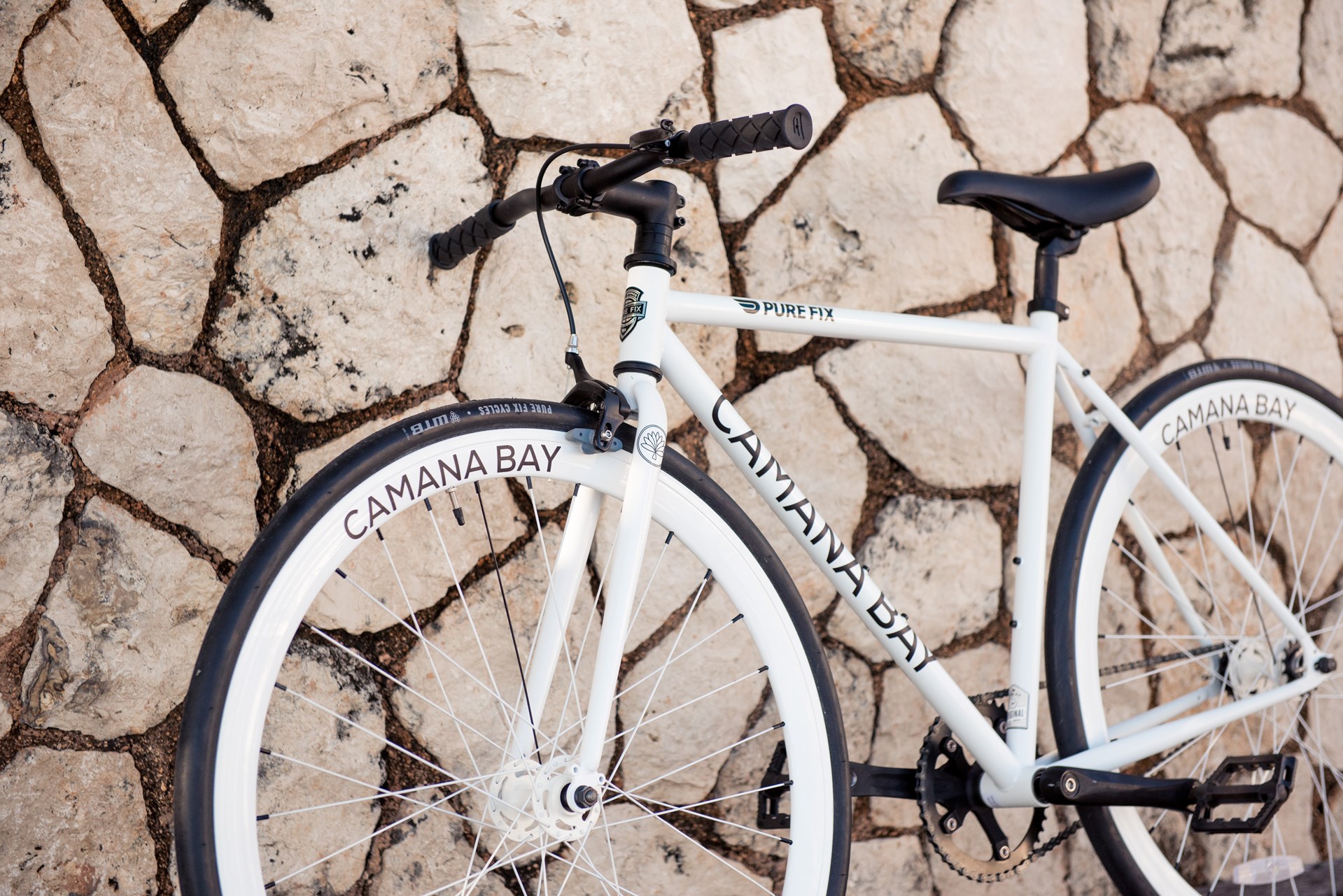 White bike against a wall