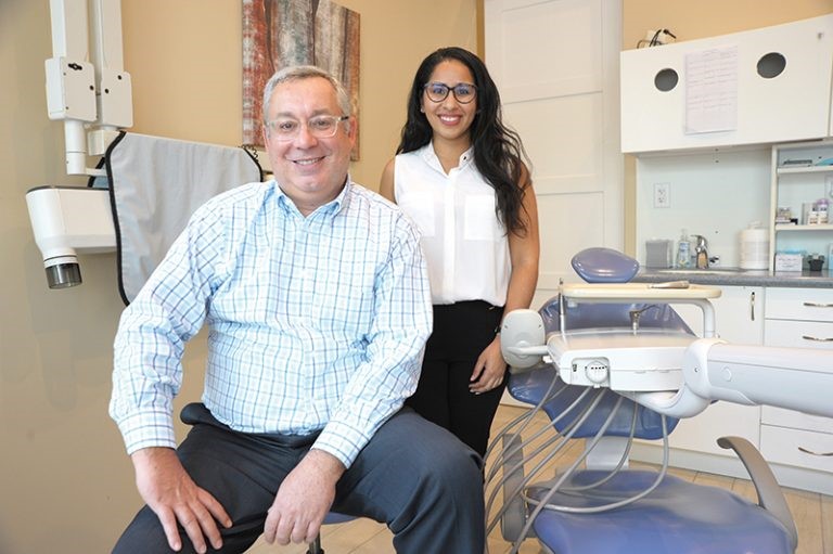 dr-charlecia-moore-and-dr-thomas-lerikos-sitting-in-a-dentist-office