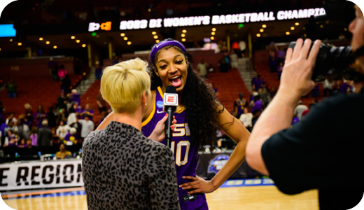 Female basketball player talking to reporter