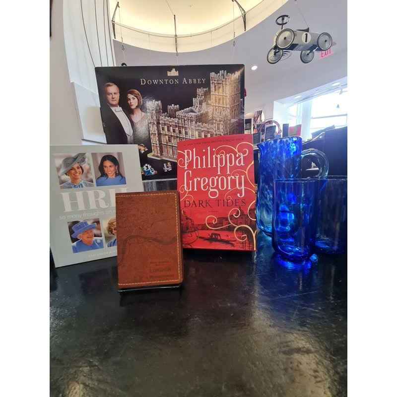 Display of books and other gifts on black countertop