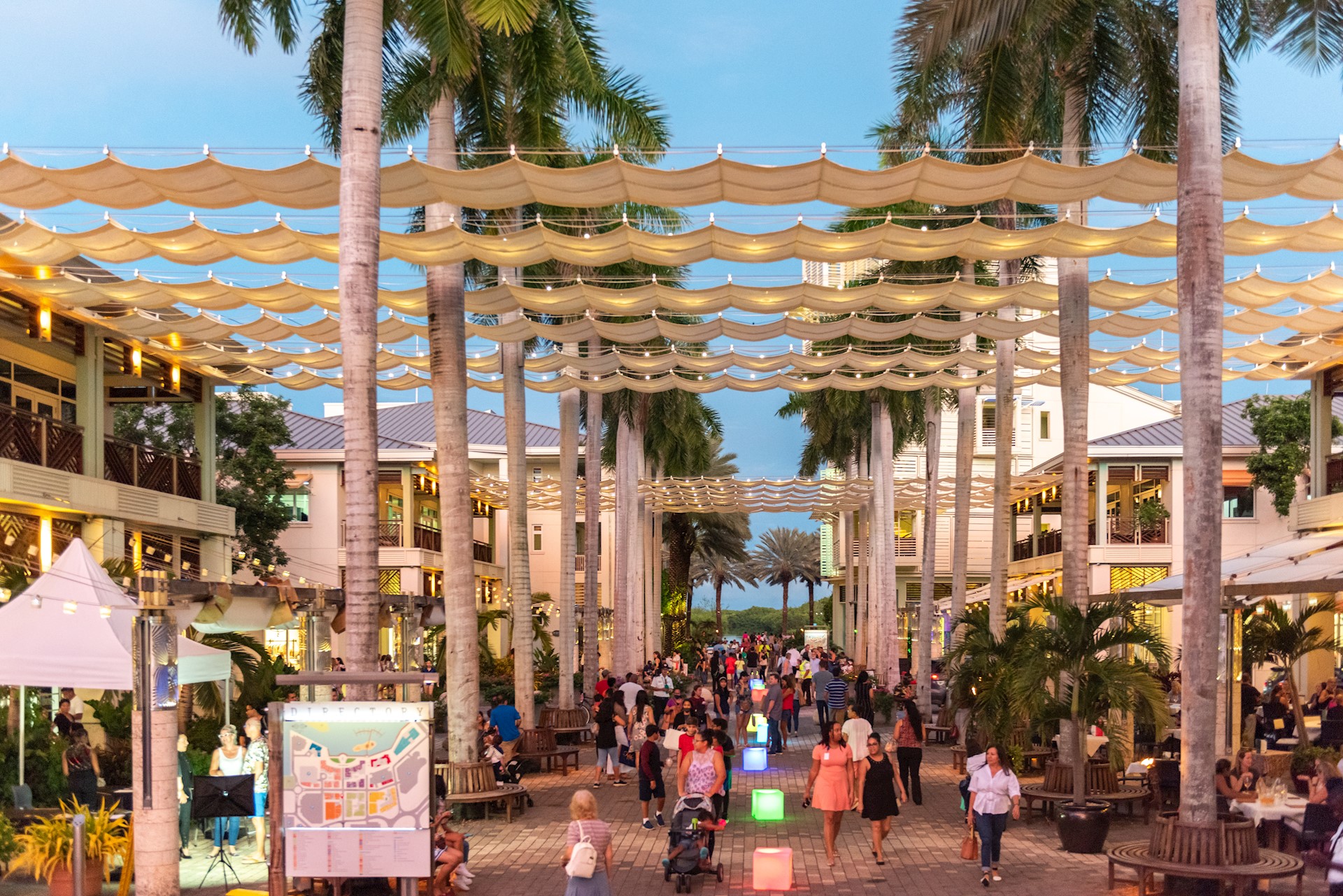 shoppers in camana bay
