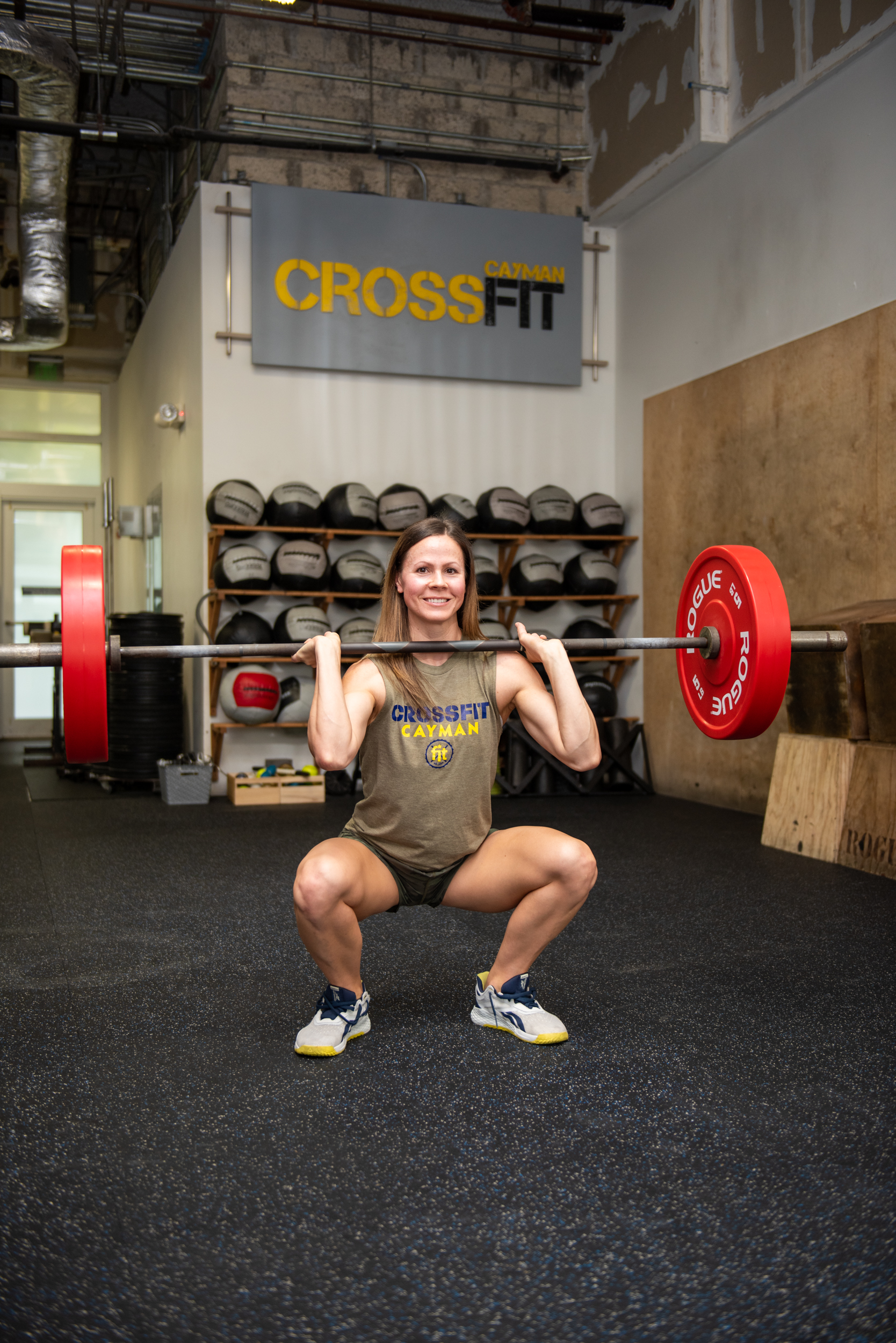 Woman squatting with barbell