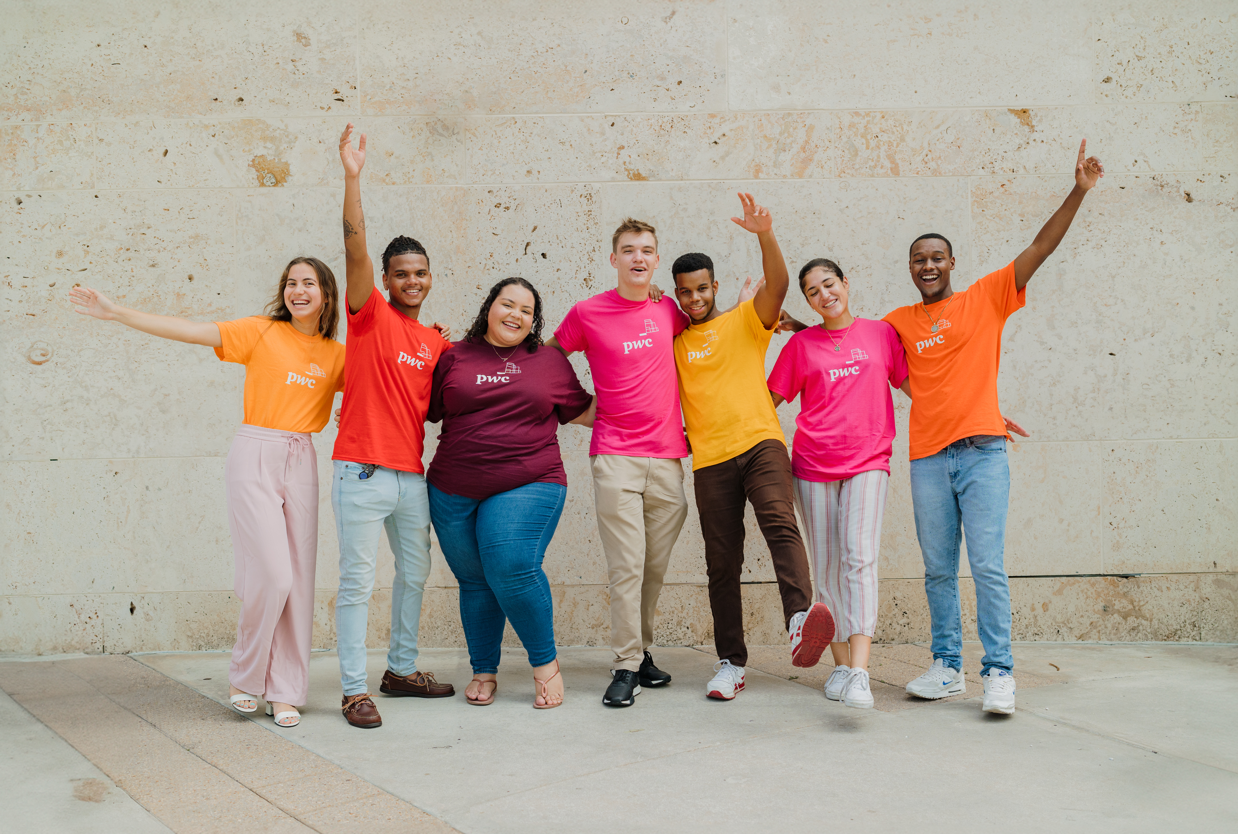 Group shot of young adults in colourful shirts