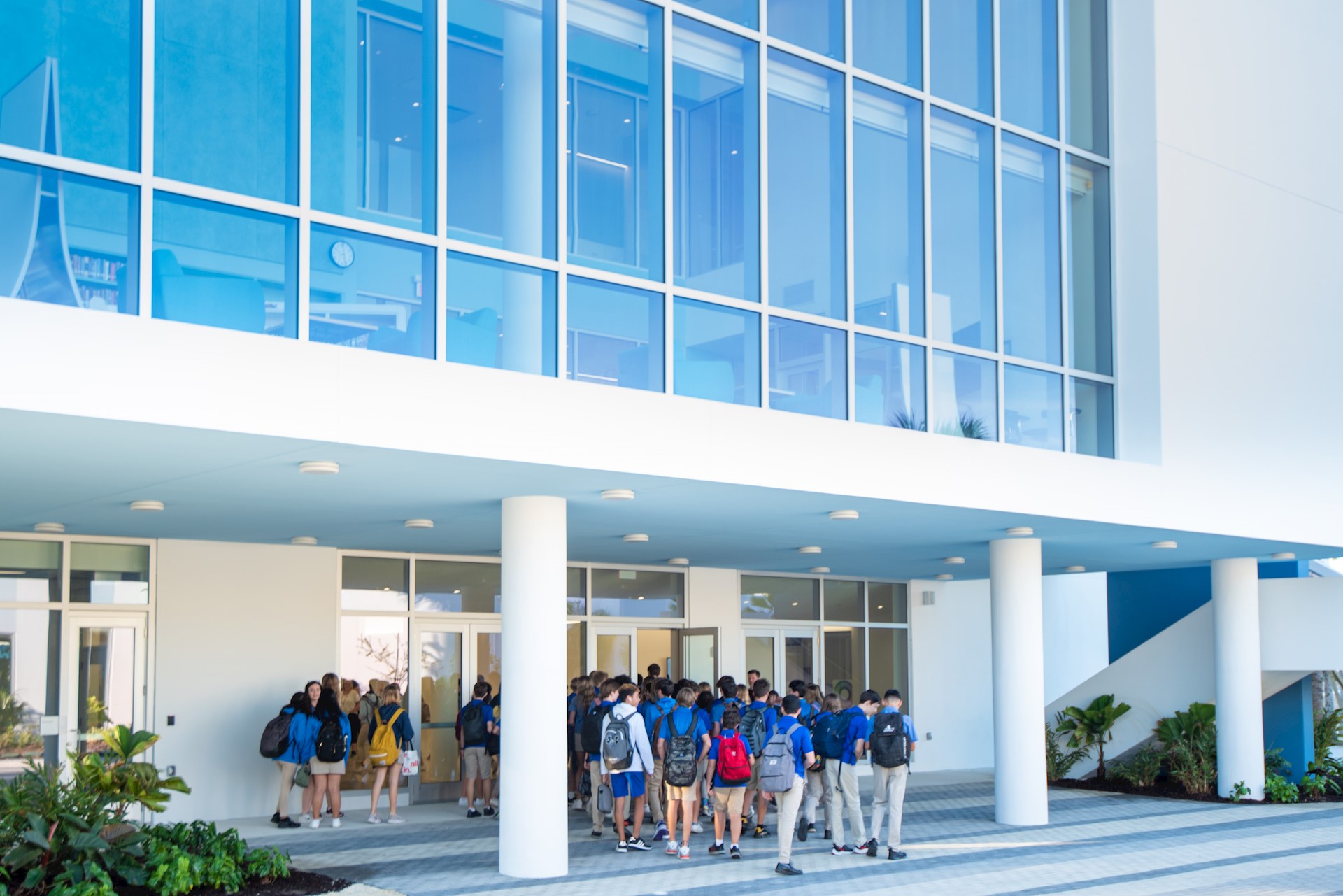 students enter high school building