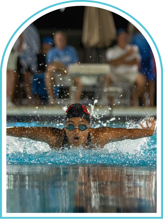Swimmer doing butterfly stroke in pool