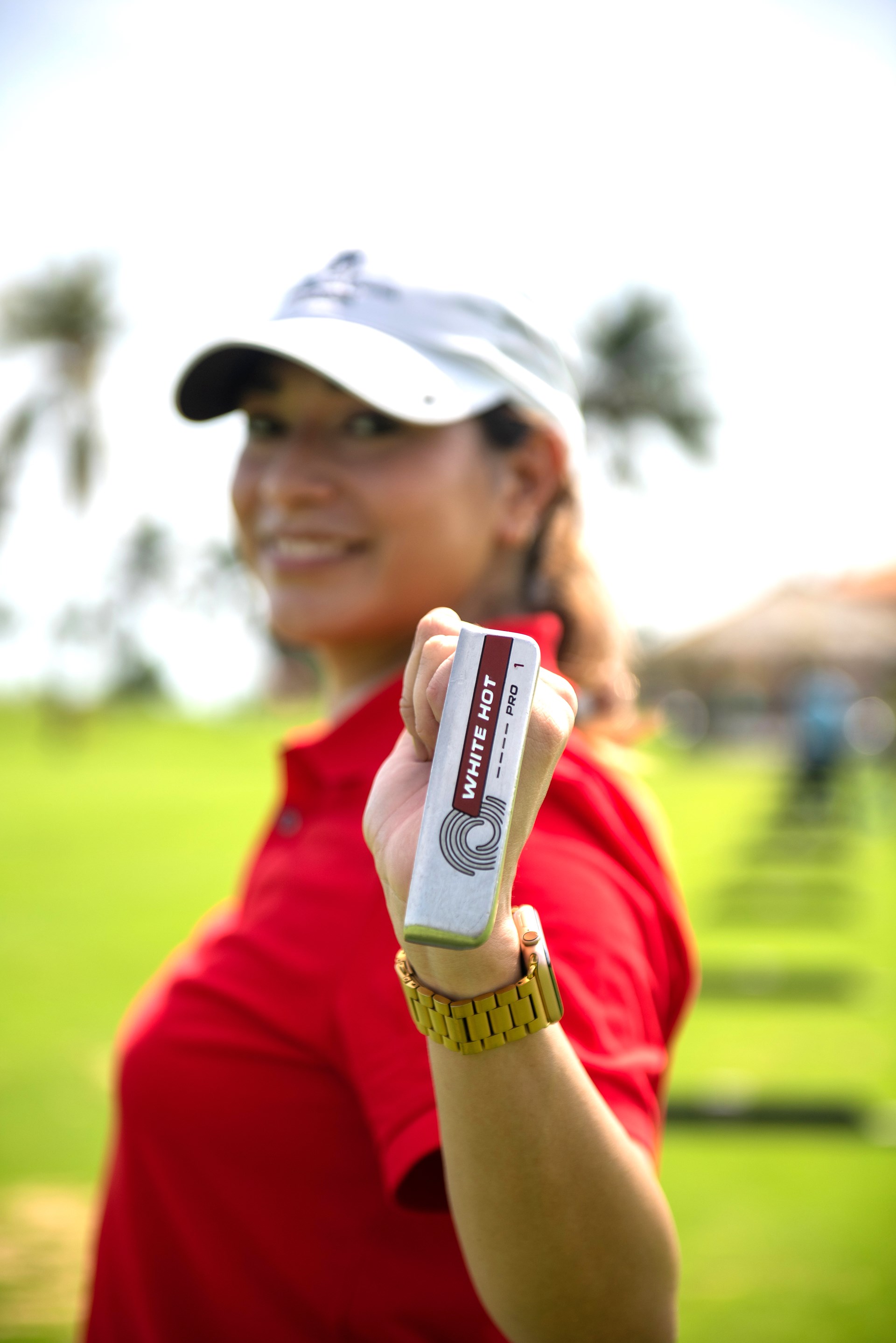 female golfer with golf club