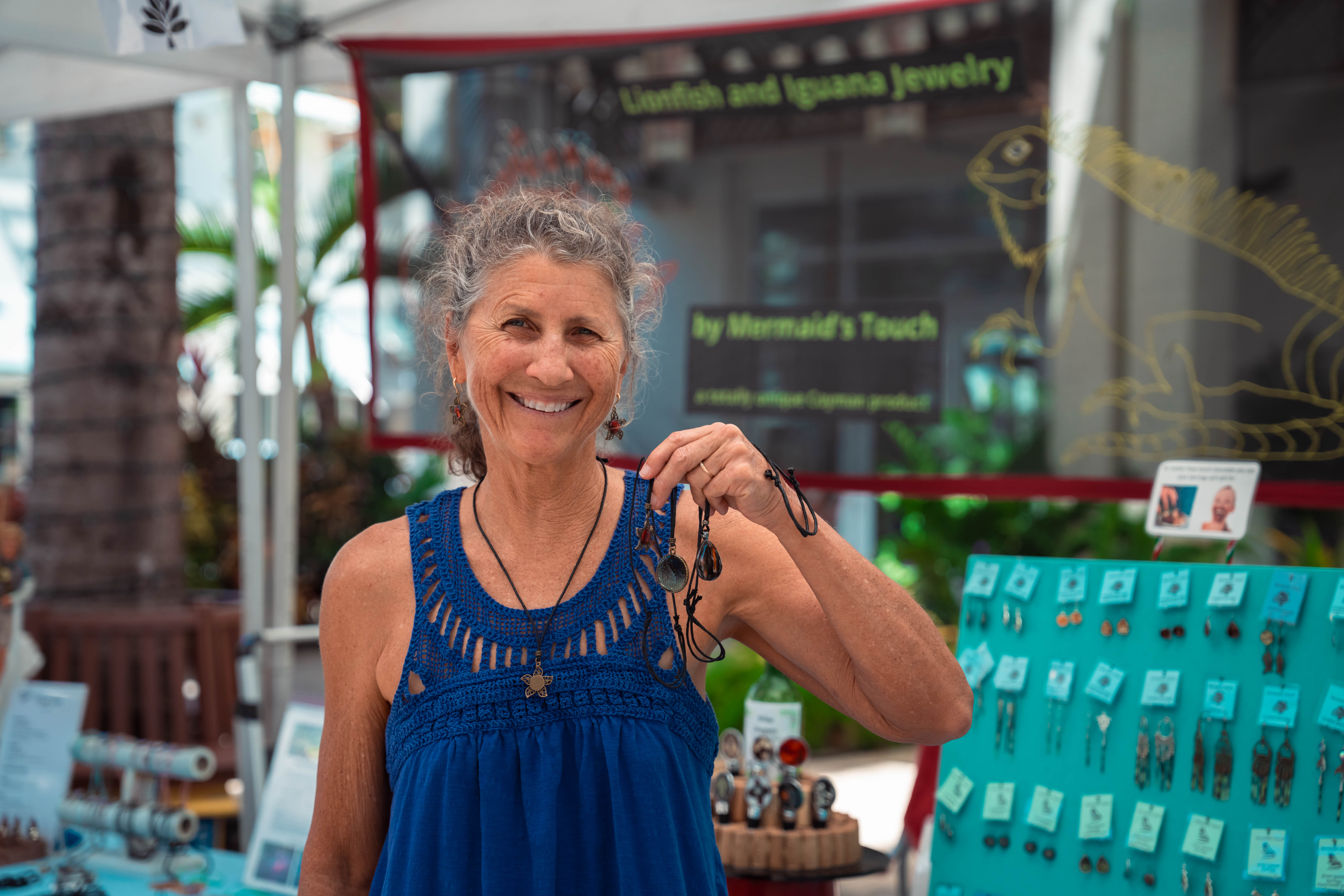 Woman holding jewellery at market