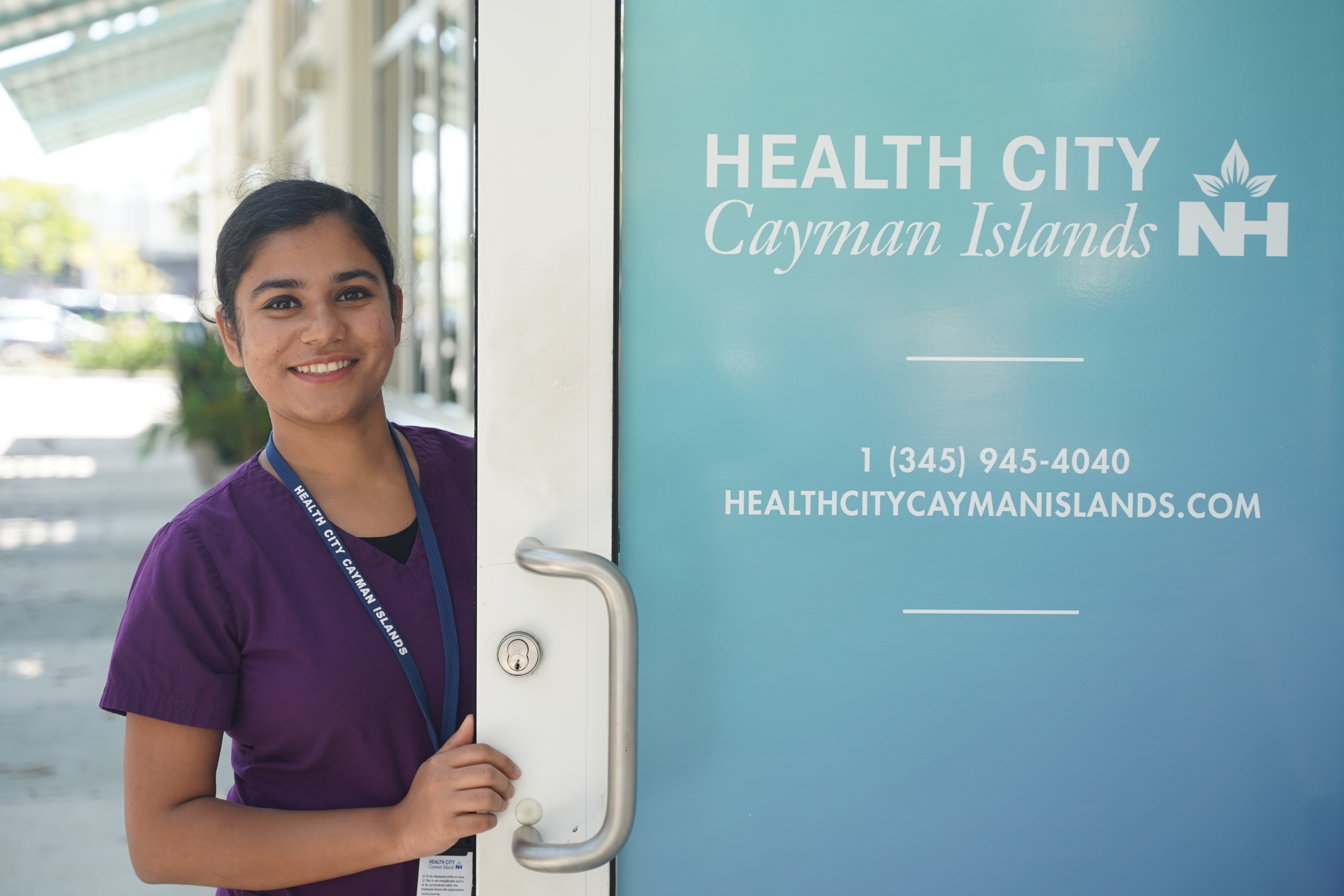 Nurse standing in front of hospital door